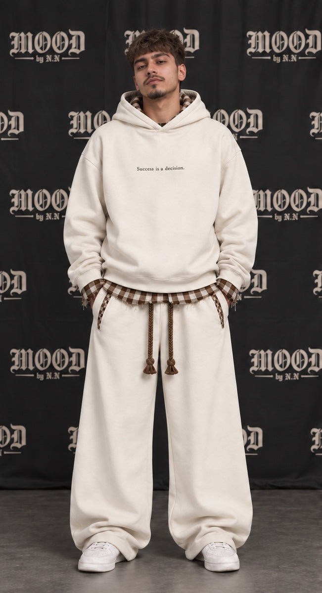 Monaco Set in beige on a model, front view: oversized hoodie with a frayed plaid layer and wide-leg trousers #color-beige