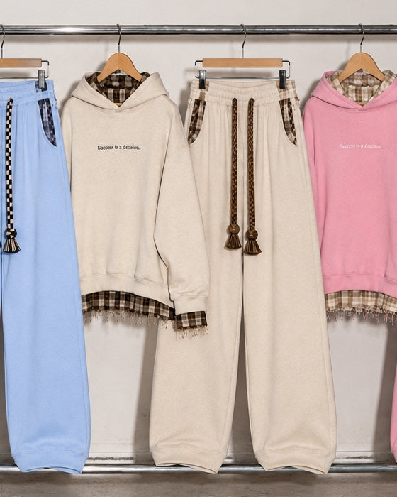 Monaco Set in beige: hoodie and wide-leg trousers hanging on a rack #color-beige