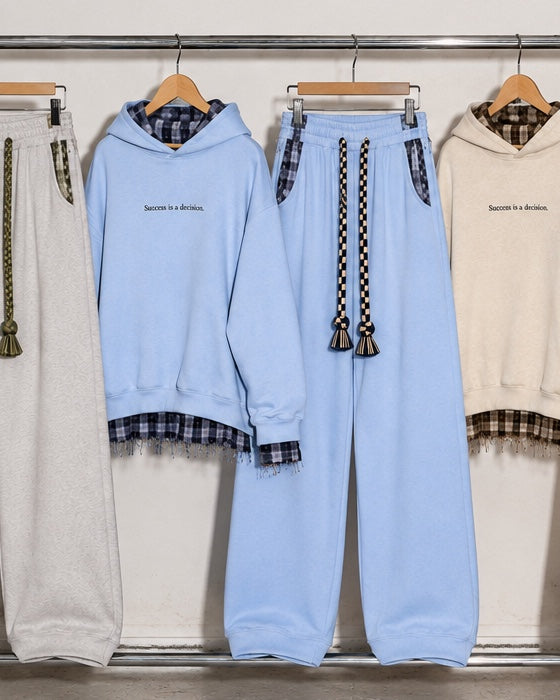 Monaco Set in blue: hoodie and wide-leg trousers hanging on a rack #color-blue