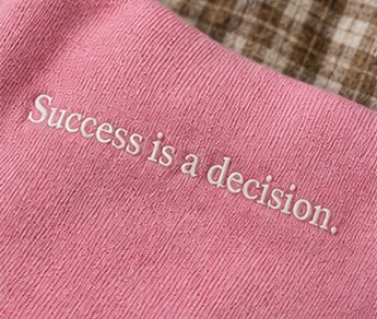Close-up: the words Success is a decision on Monaco Set in pink #color-pink