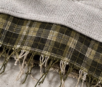 Close-up: frayed plaid hem below the hoodie, Monaco Set in gray #color-gray